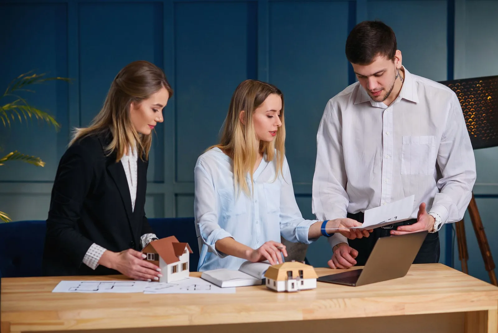 Property professionals collaborating on a rental project plan